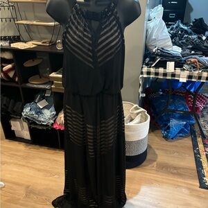 Sz 4 London Times black maxi with tan underlay. Halter neck and peep hole detail